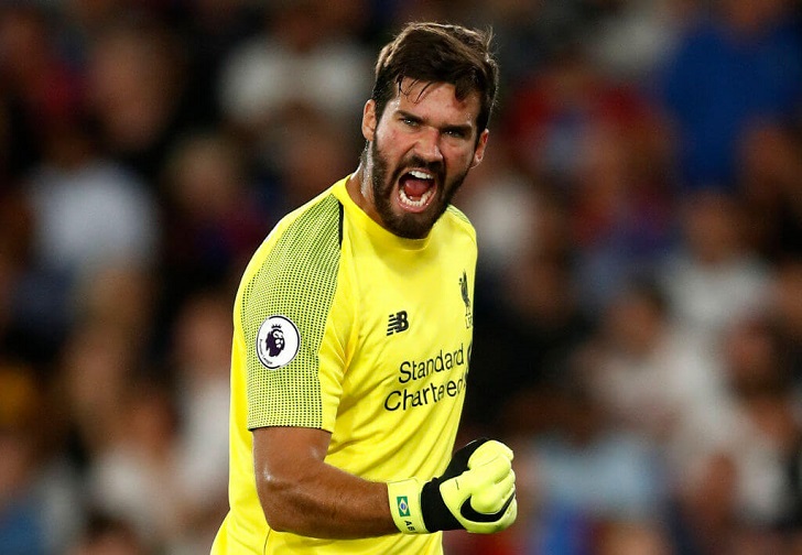 Alisson Becker in action for Liverpool.