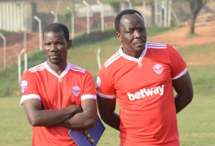 Coach George Ssimwogerere (R) and his assistant James Magala