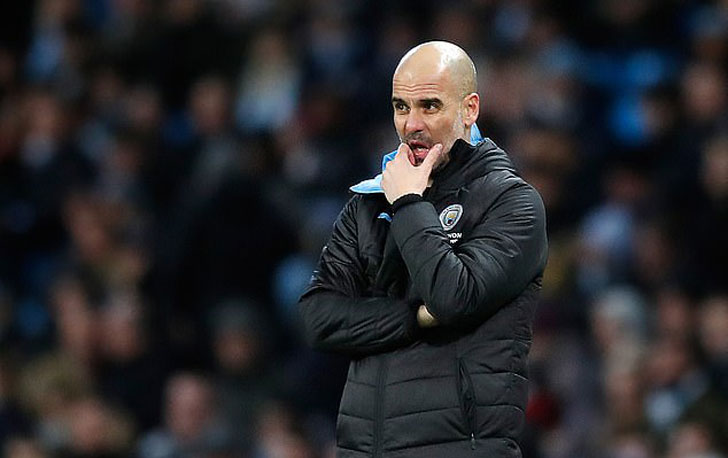 Pep Guardiola in Man City colours